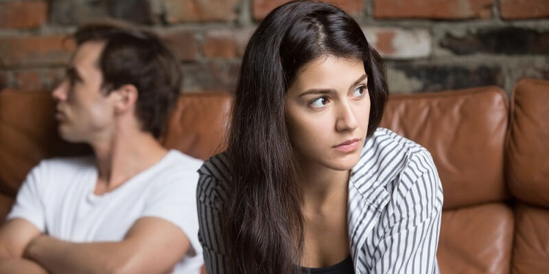 Angry unhappy young couple ignoring not looking at each other after quarrel