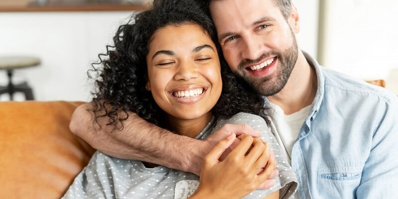 couple in embracing in living room at home