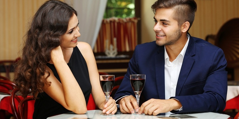 attractive young couple dating at the restaurant