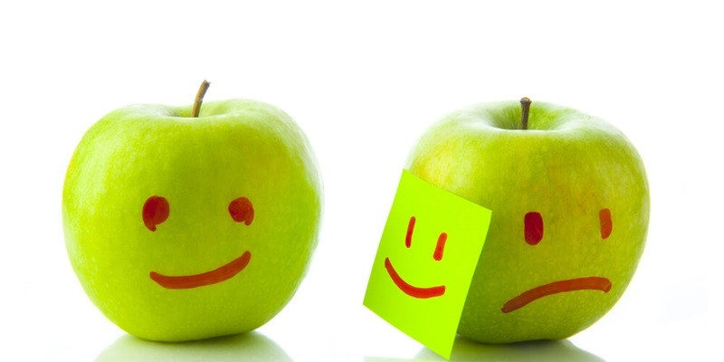 Two apples smiling and crying 