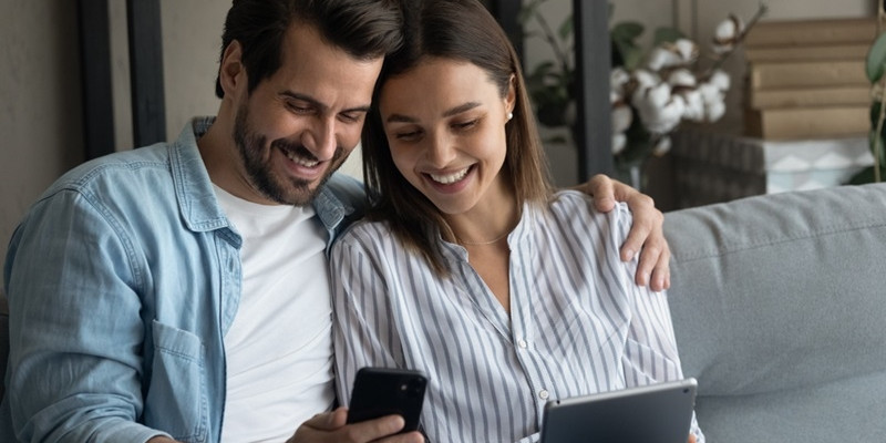 Couple is sitting together and sharing things on mobile