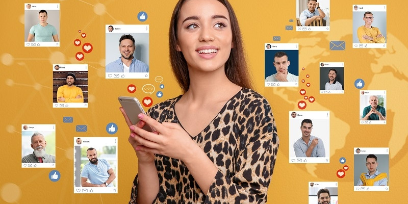 Beautiful woman visiting online dating site via smartphone on yellow background